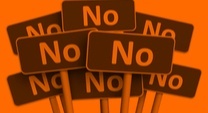 a bunch of red signs that say NO