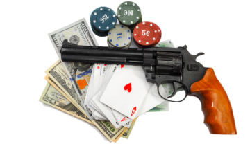 gun, chips, bills and cards