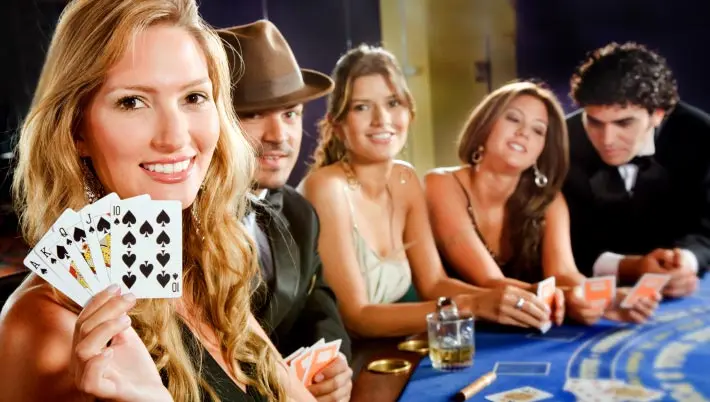 gamblers sitting around a casino table