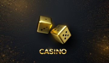 two golden dice on a black background