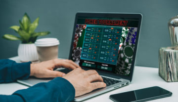 A man playing poker online on his laptop