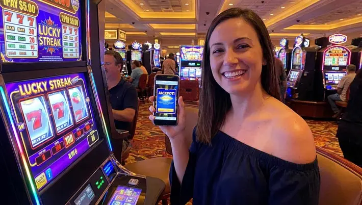 smiling woman looking at her mobile phone