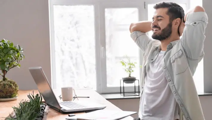 Man looking at his laptop