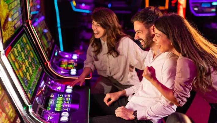 Friends playing a slot machine
