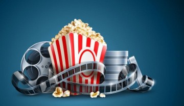 movie reels wrapped around a theater box of popcorn