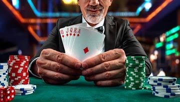 player showing a royal flush of diamonds at a poker table with chips all around