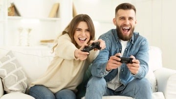 couple enjoying playing xbox together