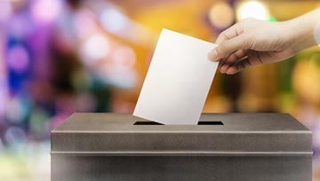Inserting a ballot slip into the ballot box