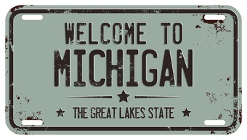 replica of a car license plate that says Welcome to Michigan