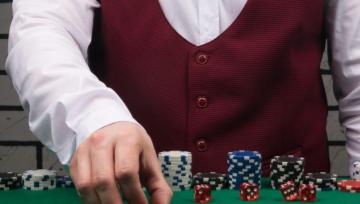 Dealer stacks casino chips