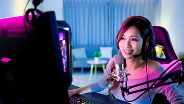 Female streamer working on her computer