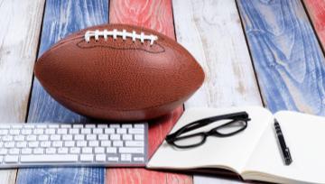 football, computer keyboard, glasses and notebook