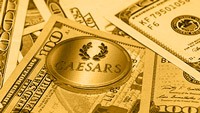 Caesars Entertainment Corp logo with money all around it