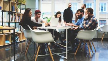 group of young people sitting around planning