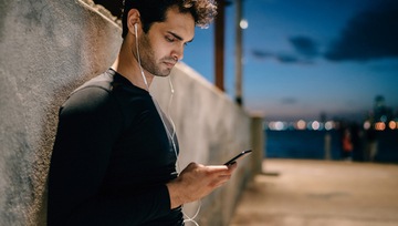 man looking at his mobile device