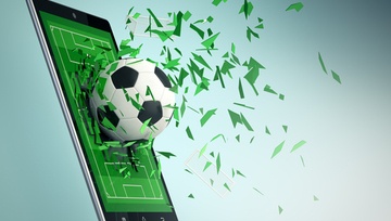 mobile phone screen with a soccer ball flying out of it