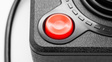 close up of an old joystick for playing video games in the 80s