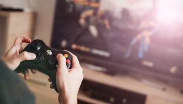 Playing using a game controller playing on a large screen