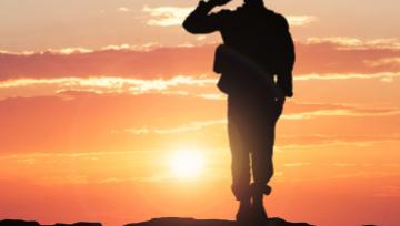silhouette of soldier saluting 