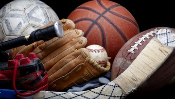 close up of sports equipment: hockey, baseball, football, basketball