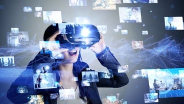 woman using a virtual reality headset indicating online casinos like Grande Vegas in the future