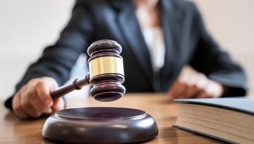 woman judge banging the gavel on her desk