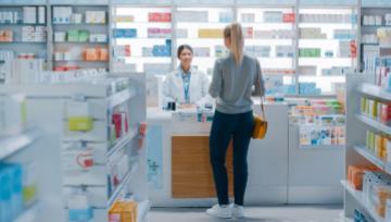 woman at a prescription drug counter 