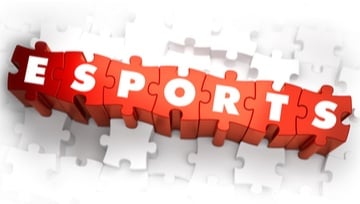 the word e-sports written on puzzle pieces in red and white