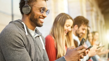 young people playing games on their smartphones 